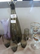 Two commemorative glasses, smoked glass decanter with glasses and a vase