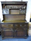 Priory style oak dresser with leaded glass panels