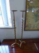 pair of wrought iron candle sticks