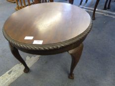 Circular occasional table on ball and claw feet