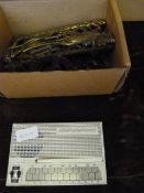 Box containing assorted horse brasses and Stylophone