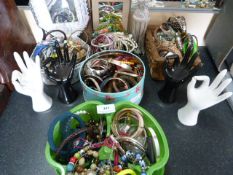 Quantity of assorted new costume jewelry and display stands