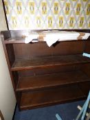 Mahogany bookcase enclosed by sliding glass doors