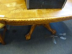 Oak occasional table with ball and claw feet