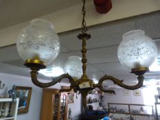 Brass three branch chandeliere with frosted glass shades