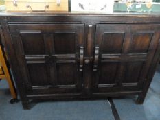 Priory style dark oak sideboard