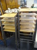 Eleven tubular steel stackable benches with beech tops