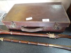 Vintage suitcase containing assorted hand tools, riding crop and a shoe horn