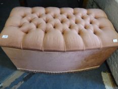 Pink upholstered ottoman