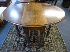 Oval oak gate leg table on barley twist legs