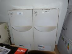 Two boxed rider white ceramic uplighters