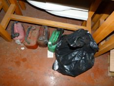 Four cans and a bag containing plumbing