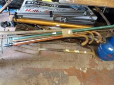 Large quantity of garden tools, walking sticks, tripods, etc