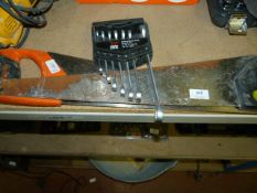 Two hand saws and seven piece metric spanner set