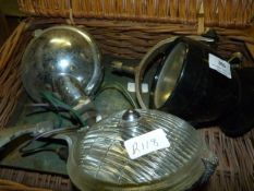 Wicker basket containing old headlamps