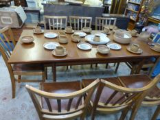 Teak Extending Dining Table with Eight Slat-Back Dining Chairs