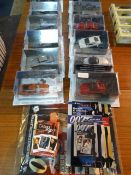 Twelve James Bond Vehicles, Five Sets of Playing Cards and Magazines