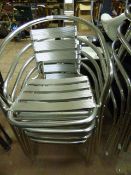 Four Tubular Framed Stackable Chairs