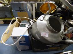 Box Containing Assorted Kitchen Tools and a Fan Heater