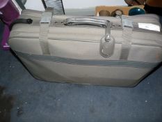 Suitcase Containing Assorted Books