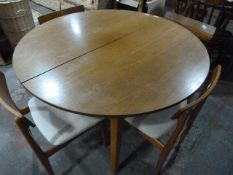Circular Extending Teak Table with Four Chairs