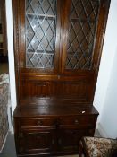 Old Charm Oak Wall Unit Enclosed by Leaded Doors with Linen Fold Panels