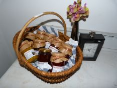 Basket Containing Assorted Preserves, Wall Clock and a Floral Decoration