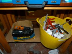 *Sixteen Tubes of Silicone and Silicone Guns