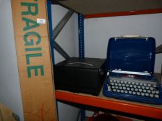 Portable Typewriter, Slide Projector, CD Case and a Projection Screen