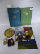 Collection of Military Books, Pin Dish, Cigarette Holder and a Camel Lighter