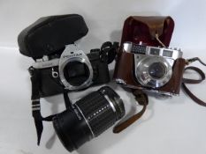 Kodak Camera and a Pentax Camera with Lens
