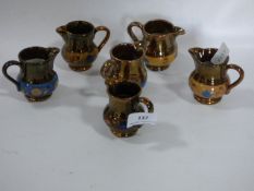 Six Miniature Lustre Jugs