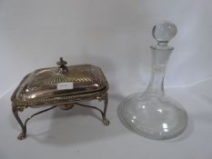 Plated Wall Mat and a Glass Decanter