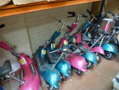 *Eight Pink and Green Rechargeable E-Scooters