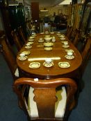 Oriental Style Extending Oval Dining Table with Two Leaves and Eight Chairs; Two Carvers and Six