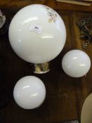 Three Light Globes One of Which is Handpainted