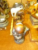 Assorted Decorative Elephants and a Chinese Deity