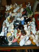 Large Collection of Ceramic, Glass and Pot Miniature Shoes