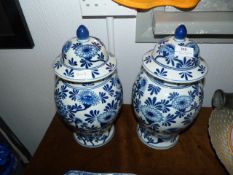 Pair of Blue and White Lidded Vases