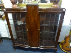 Serpentine Front Display Cabinet with Leaded Glass Doors on Ball and Claw Feat