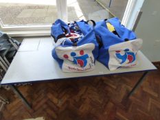 *Square Legged Table and Two Bags Containing Assorted Sports Equipment