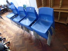 *Twenty Nine Stackable Chairs on Tubular Legs with Blue Polypropylene Seats