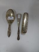 Two Silver Brushes and a Silver Handled Shoe Horn