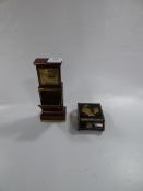 Two Cigarette Dispenser One as a Grandfather Clock