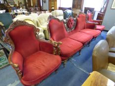 Elaborately Carved High Backed Red Upholstered Three Seat Settee and Two Armchairs