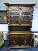 Ornately Carved Oak Glazed Cupboard