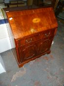 Figured Mahogany Reproduction Bureau with Inlaid Detail on Bracket Feet