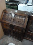 Priory Style Oak Bureau with Linen Fold Panels