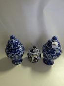 Pair of Blue and White Lidded Vases and Another