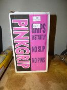 Box Containing Assorted Pink Grip and Carpet Protector